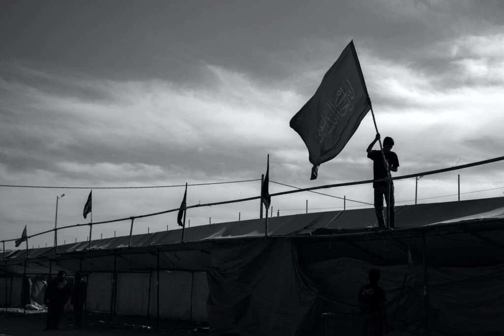 photo of ISIS supporter carrying flag