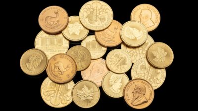 gold round coins on white background